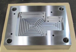 rough machined steel plate with holes and pocket work